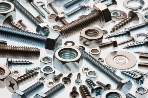 Various metal screws and fasteners scattered