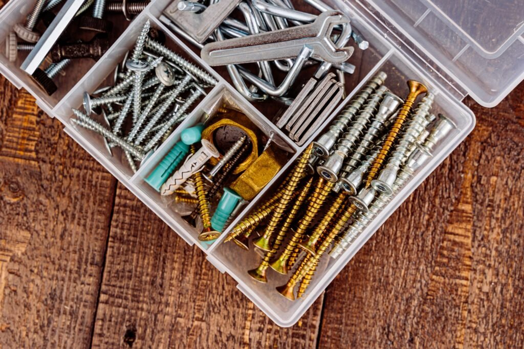 Assorted screws and hardware in container